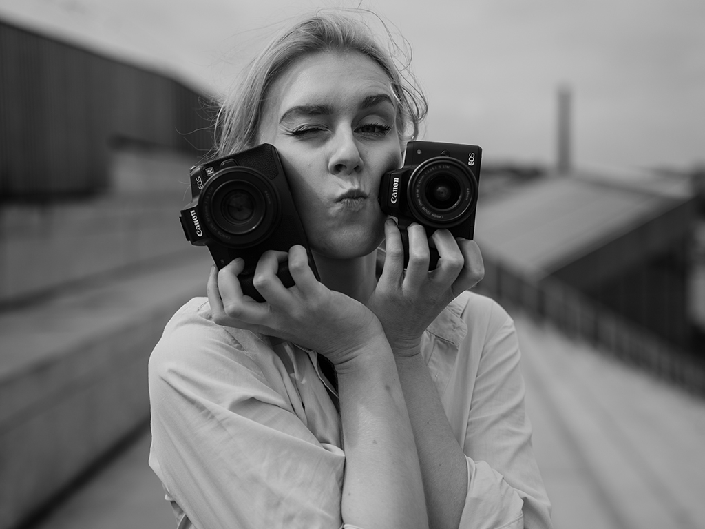 woman with cameras